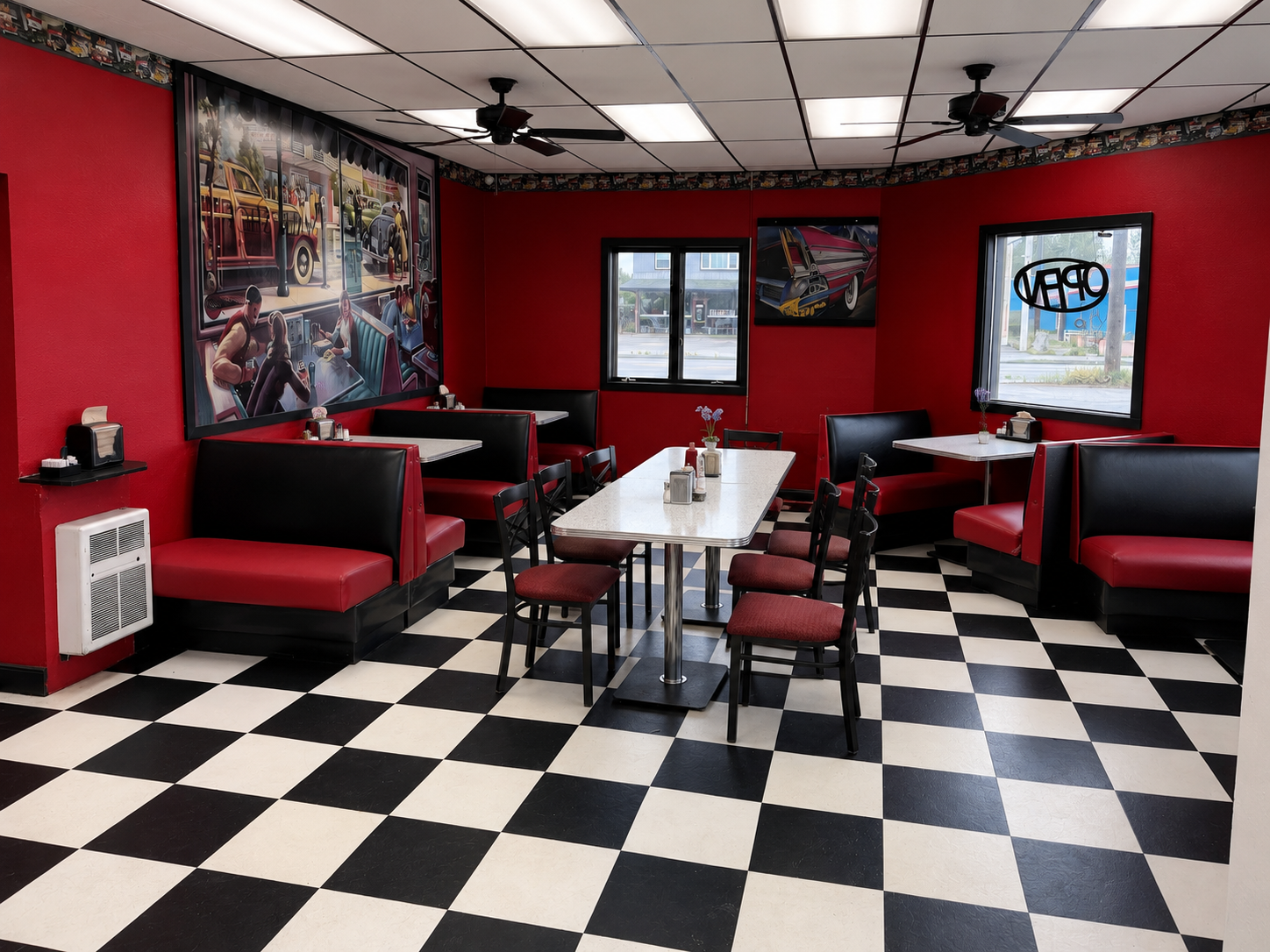 Inside C&J's Drive In with red booths and checkered floor